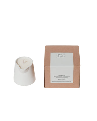 White candle and brown box with a label on a white background