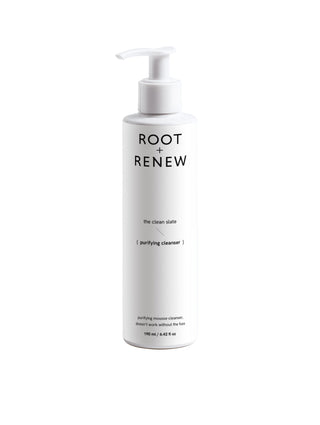 White bottle of 'Root + Renew' on a light gray background